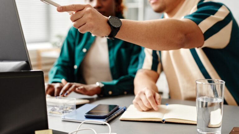 Team members learning SAP BPC skills during a hands-on project workshop